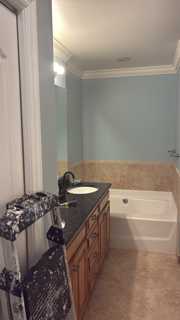 Naples bathroom vanity and warm neutral walls before painting
