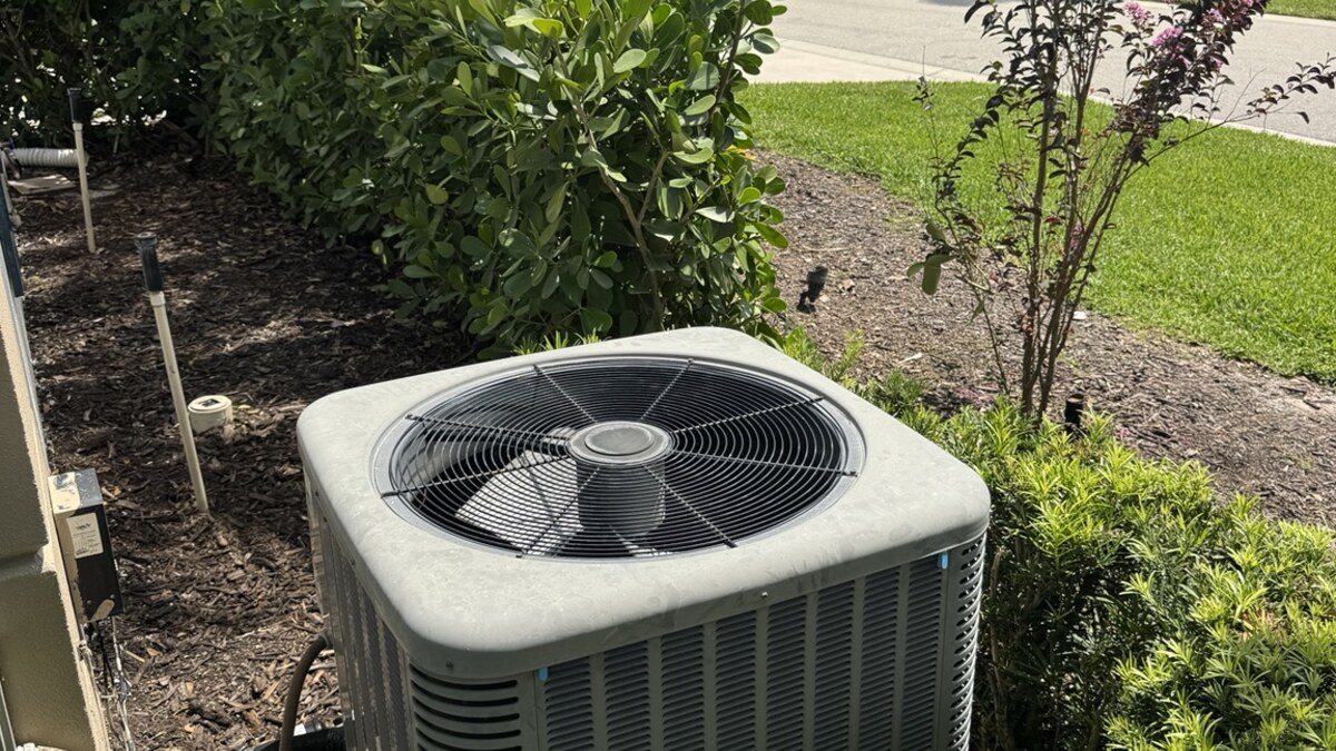 Outdoor AC condenser at a Naples home